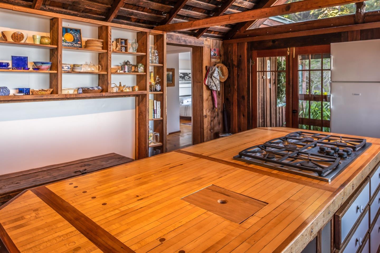 29141 Plasket Ridge Road Big Sur, CA 93920 - Photo 22 of 48 a bedroom with a bed and a window