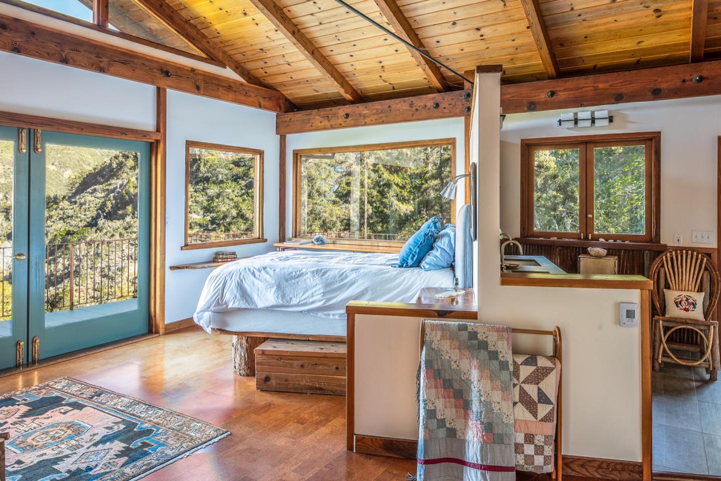 29141 Plasket Ridge Road Big Sur, CA 93920 - Photo 23 of 48 a living room with furniture and a open kitchen view