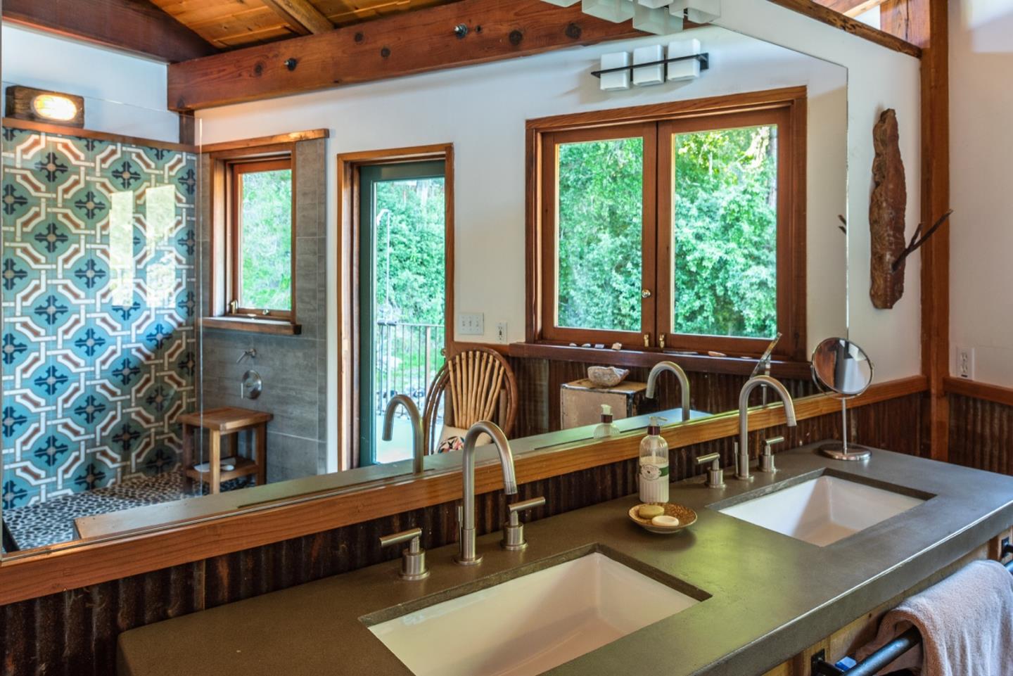 29141 Plasket Ridge Road Big Sur, CA 93920 - Photo 26 of 48 a living room with furniture and a window