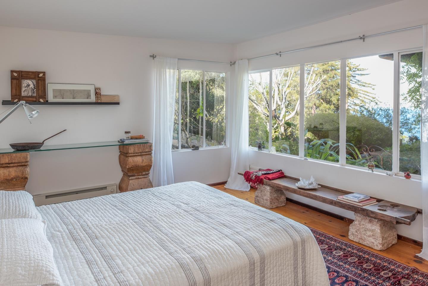 29141 Plasket Ridge Road Big Sur, CA 93920 - Photo 29 of 48 a bedroom with furniture and a large window