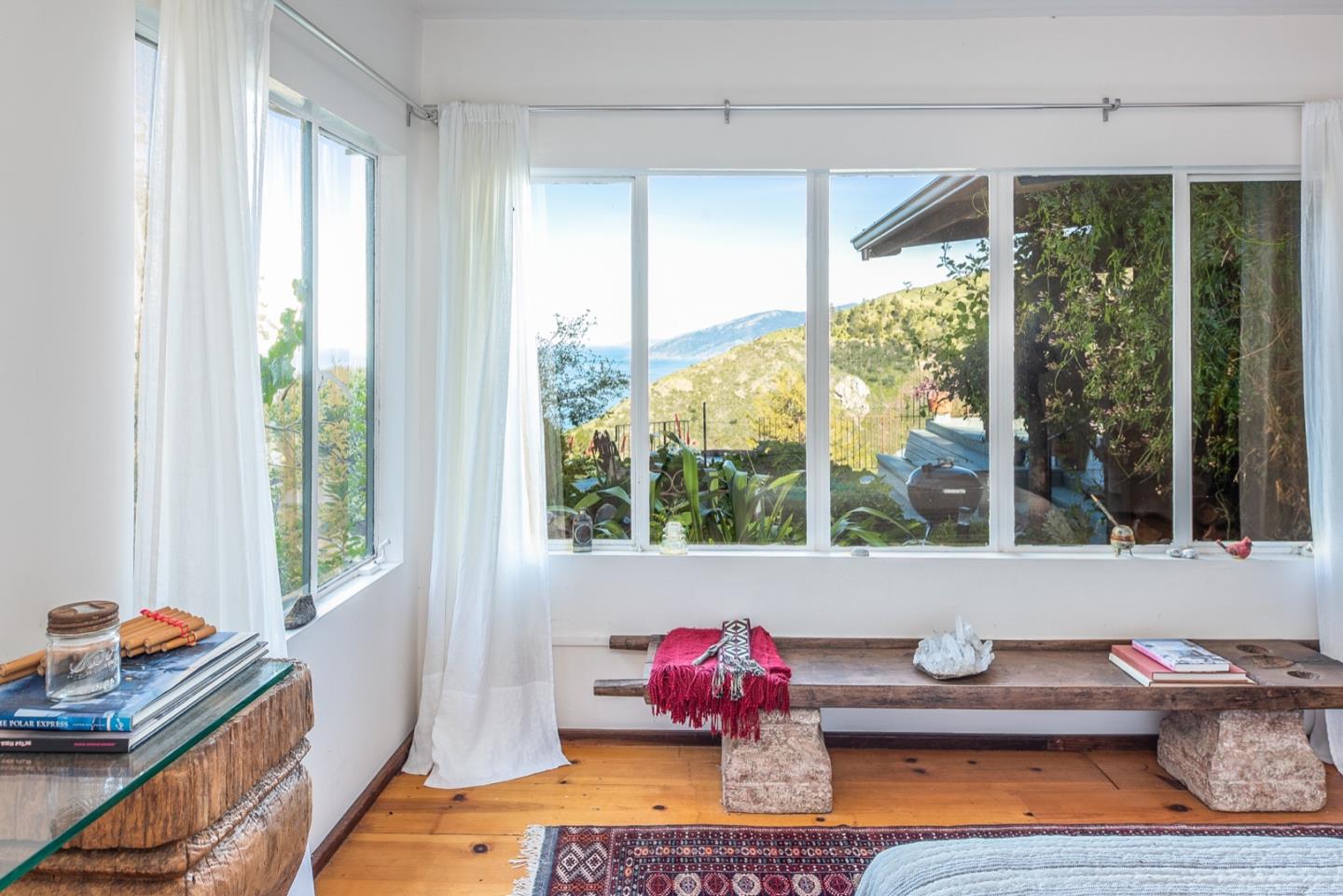 29141 Plasket Ridge Road Big Sur, CA 93920 - Photo 30 of 48 a living room with furniture and a window