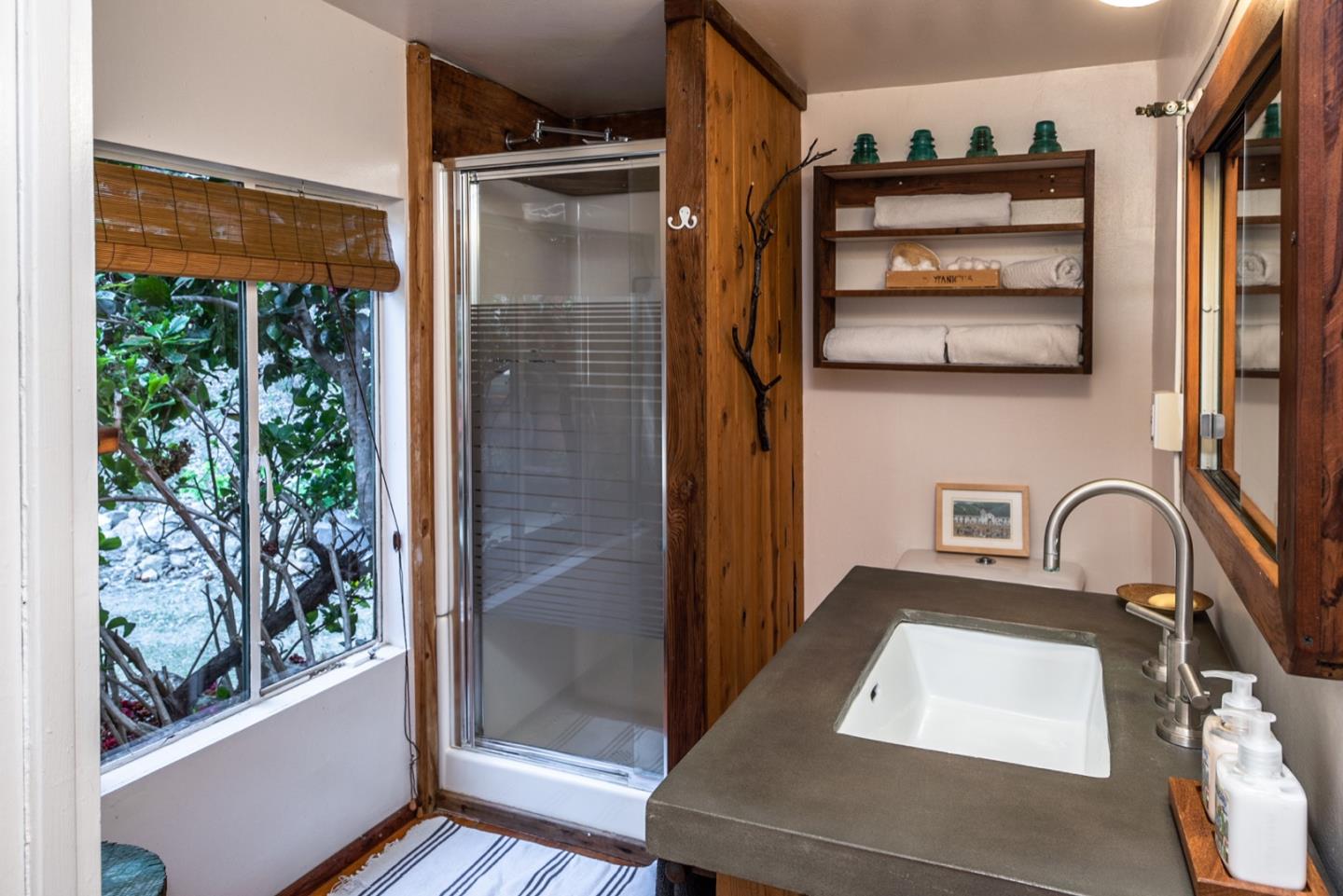 29141 Plasket Ridge Road Big Sur, CA 93920 - Photo 31 of 48 a bathroom with a shower and a sink