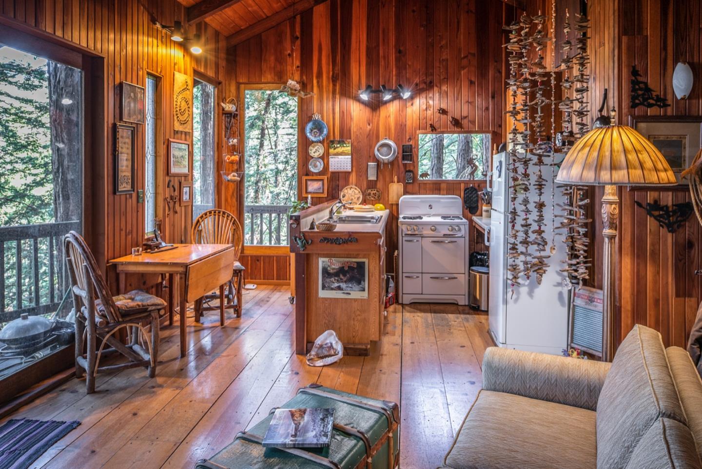 29141 Plasket Ridge Road Big Sur, CA 93920 - Photo 38 of 48 a living room with furniture and a fireplace