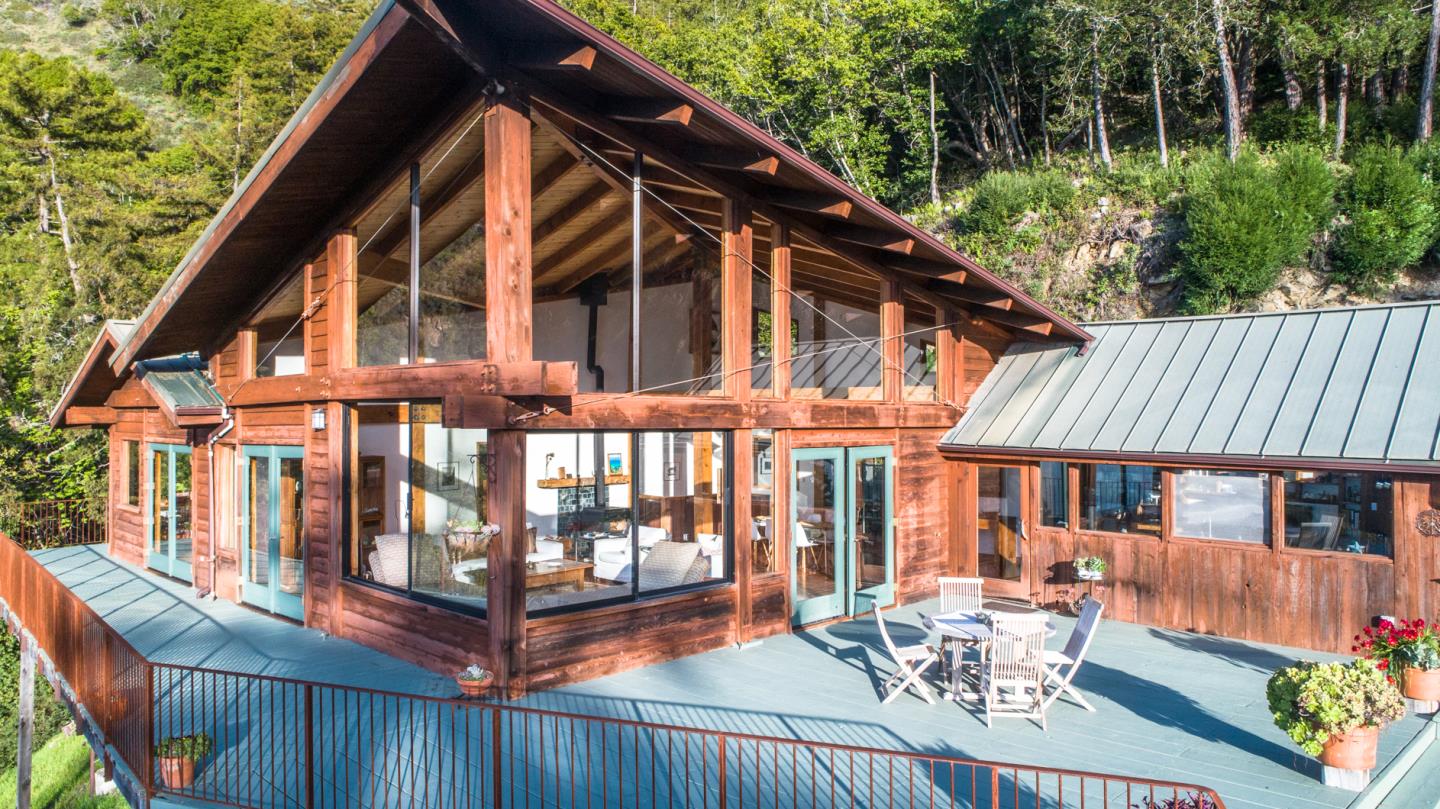 29141 Plasket Ridge Road Big Sur, CA 93920 - Photo 42 of 48 a patio with sofas fire pit table and chairs