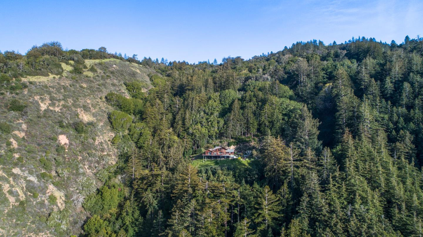 29141 Plasket Ridge Road Big Sur, CA 93920 - Photo 44 of 48 a view of a city with lush green forest
