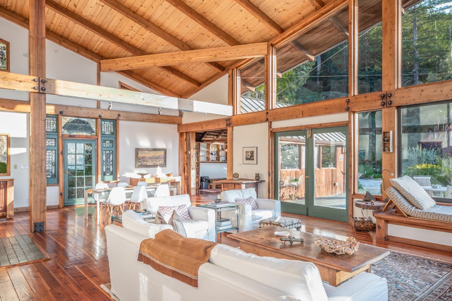 29141 Plasket Ridge Road Big Sur, CA 93920 - Photo 5 of 48 a living room with furniture and a large window