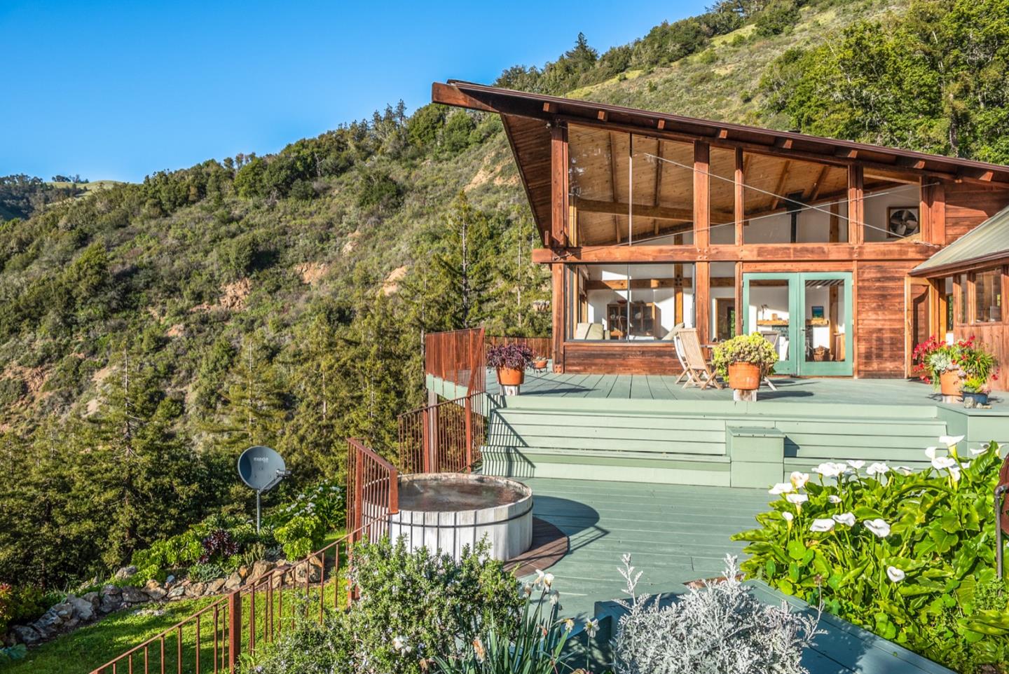 29141 Plasket Ridge Road Big Sur, CA 93920 - Photo 6 of 48 a front view of a house with a yard