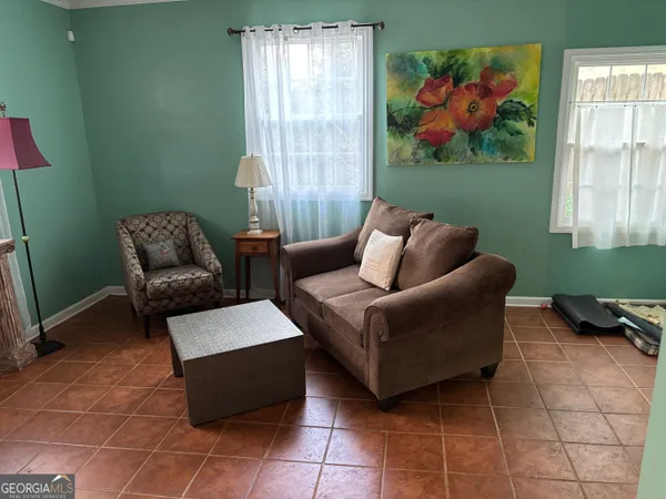 a living room with furniture and a window