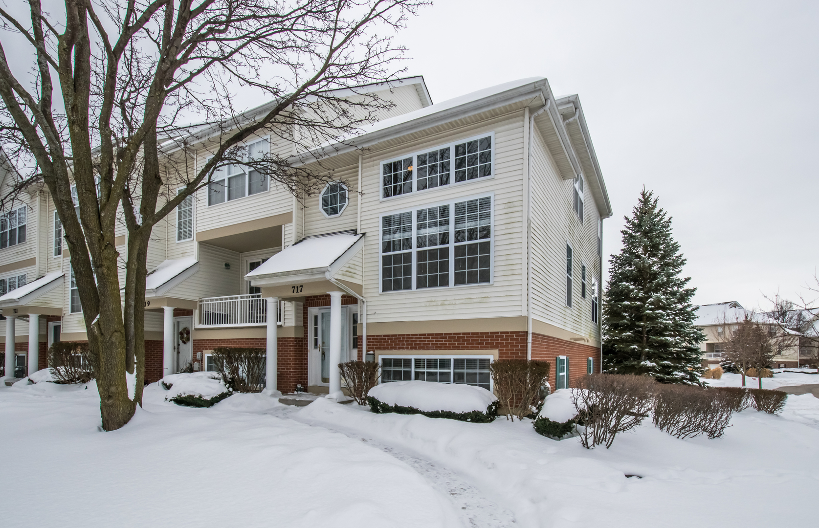 717 Pheasant Trail St. Charles, IL 60174 - Photo 1 of 32 a view of a house with a barbeque and large trees