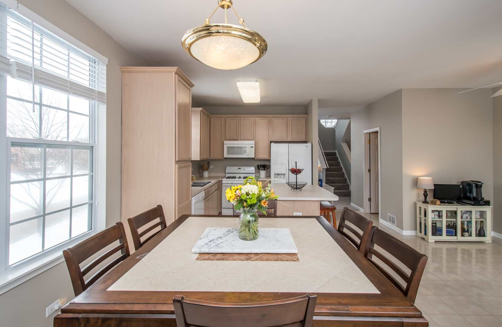 717 Pheasant Trail St. Charles, IL 60174 - Photo 14 of 32 a living room with kitchen island furniture and a window