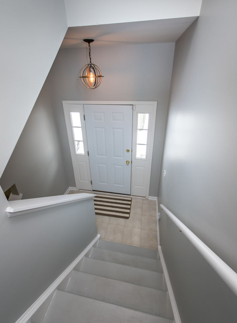 717 Pheasant Trail St. Charles, IL 60174 - Photo 21 of 32 a view of entryway and stairs