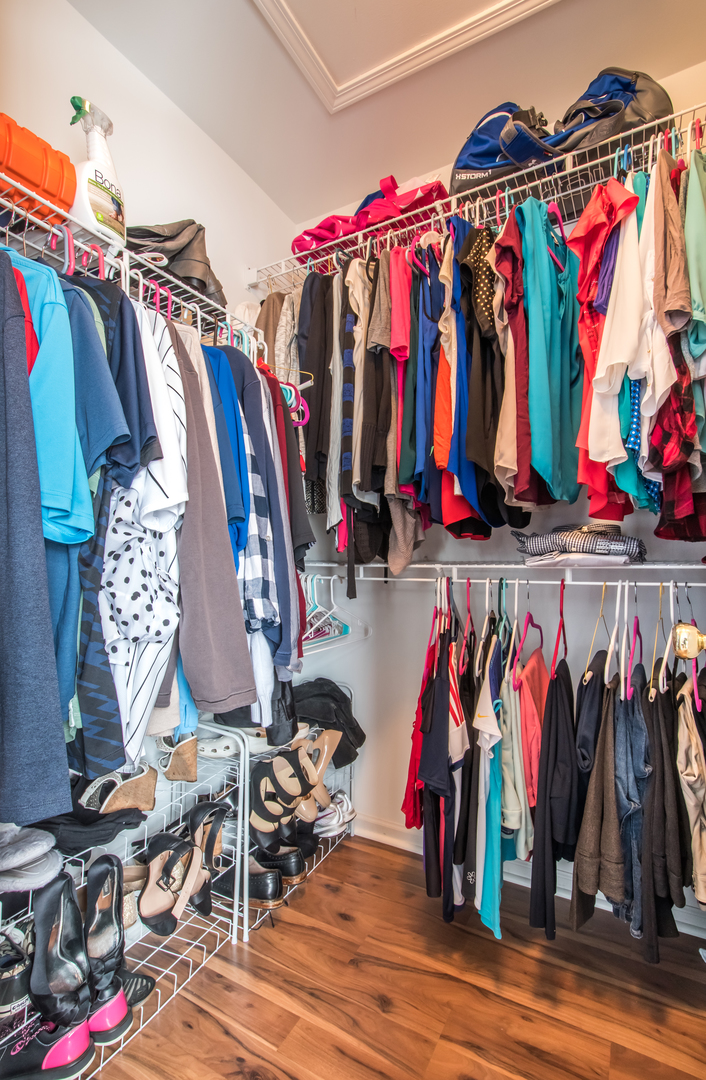 717 Pheasant Trail St. Charles, IL 60174 - Photo 26 of 32 a view of walk in closet with clothes