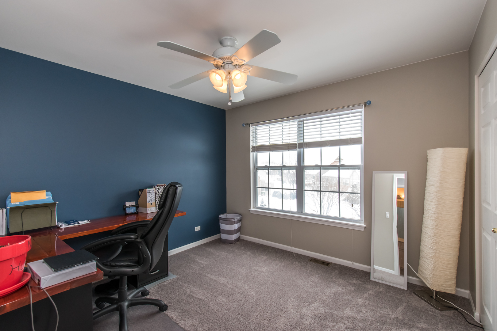 717 Pheasant Trail St. Charles, IL 60174 - Photo 27 of 32 a view of a workspace with furniture and a window