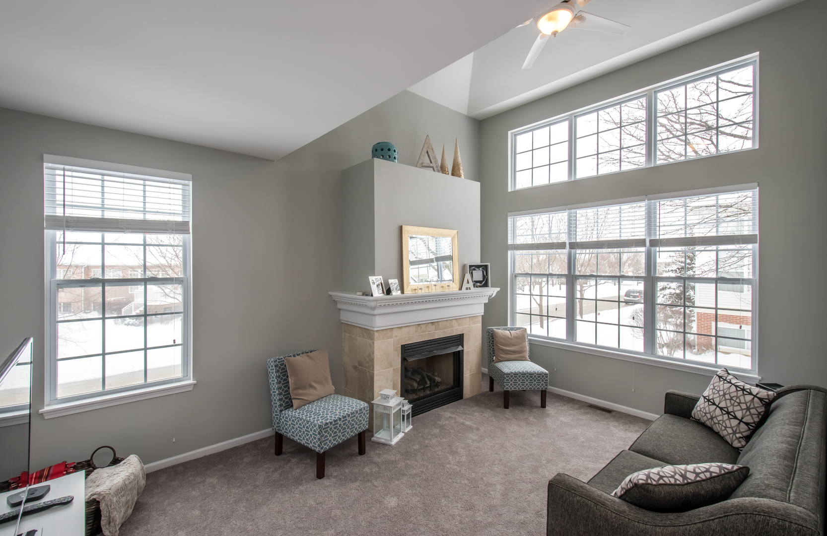 717 Pheasant Trail St. Charles, IL 60174 - Photo 4 of 32 a living room with furniture and a fireplace