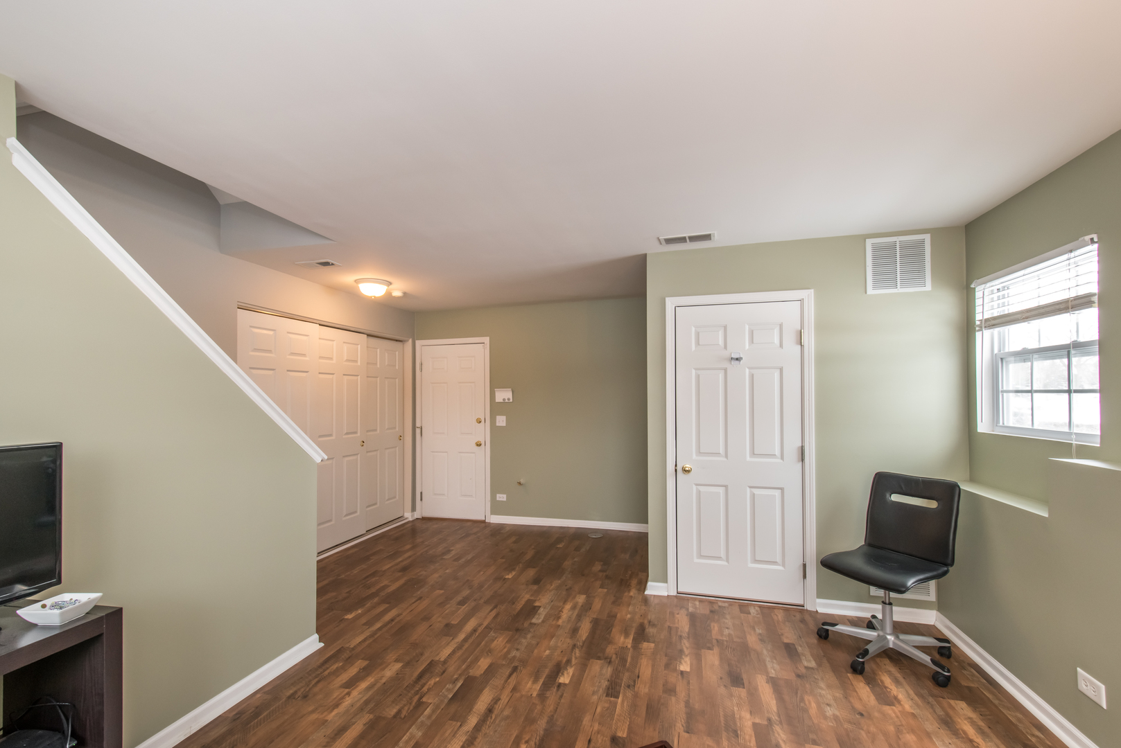 717 Pheasant Trail St. Charles, IL 60174 - Photo 31 of 32 a view of a workspace with furniture and wooden floor
