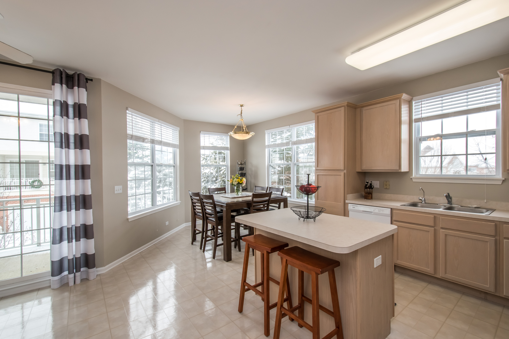 717 Pheasant Trail St. Charles, IL 60174 - Photo 8 of 32 a kitchen with lots of counter top space and dining table