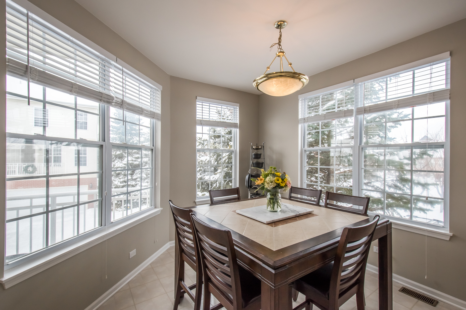717 Pheasant Trail St. Charles, IL 60174 - Photo 10 of 32 a view of a dining room with furniture window and outside view