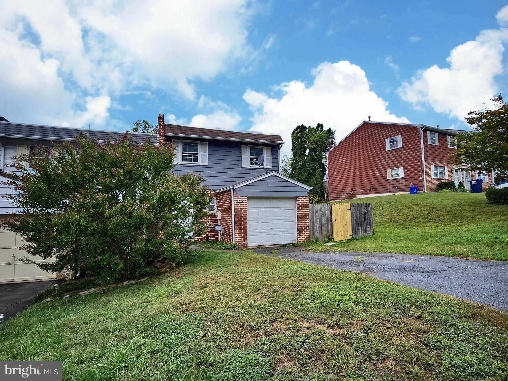 1213 Deer Run Reading, PA 19606 - Photo 2 of 42 a view of a brick house with a yard
