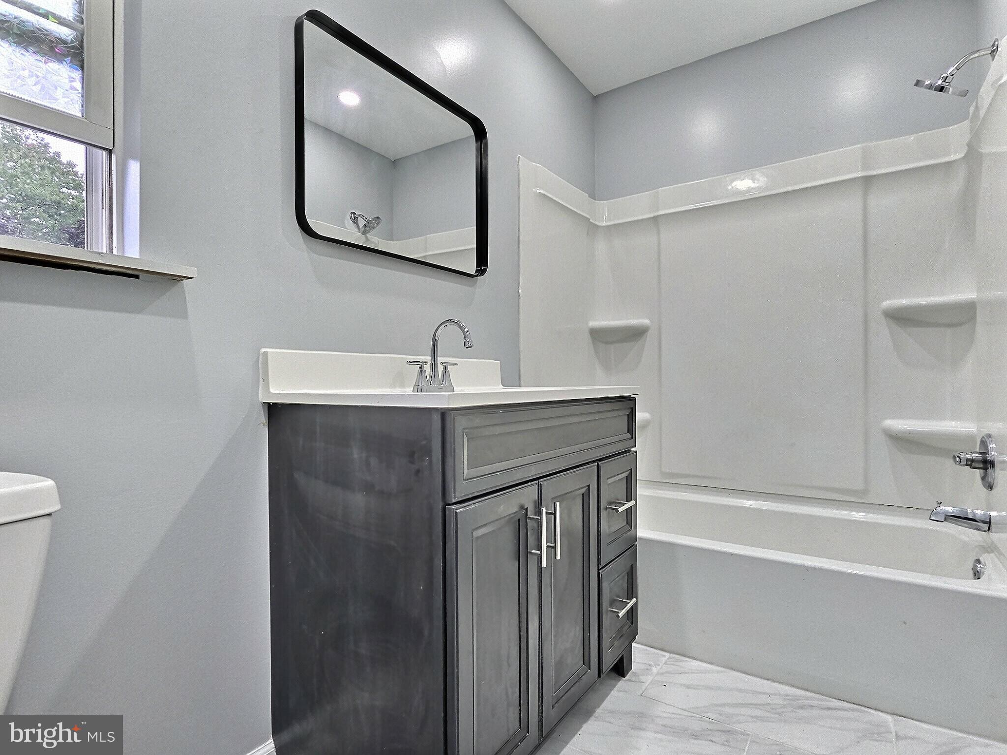 1213 Deer Run Reading, PA 19606 - Photo 22 of 42 a bathroom with a tub sink mirror and vanity