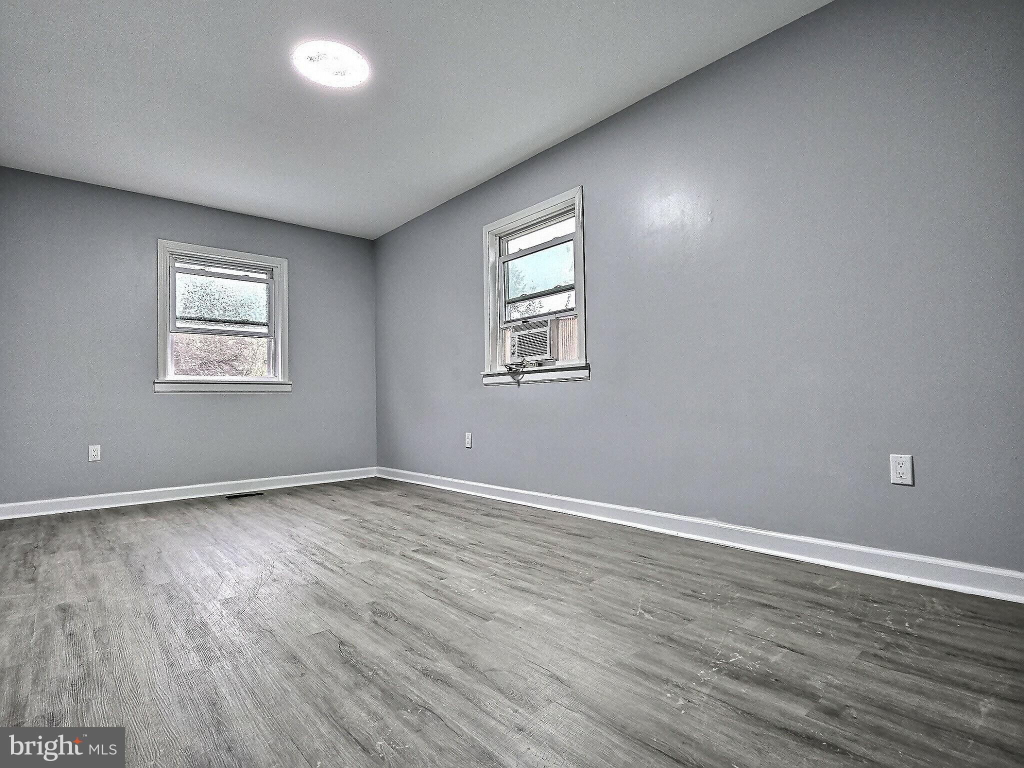 1213 Deer Run Reading, PA 19606 - Photo 25 of 42 an empty room with wooden floor and windows