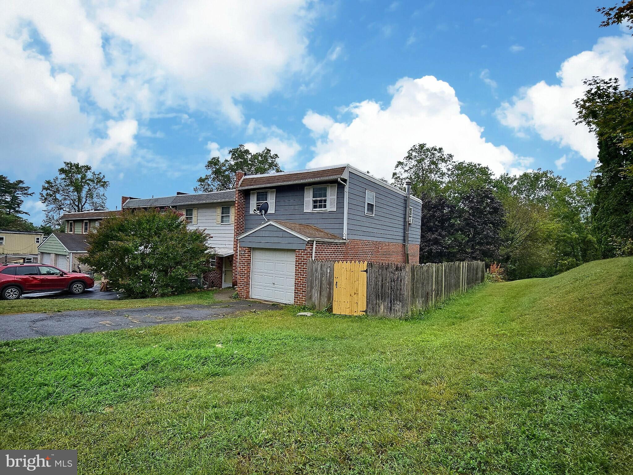 1213 Deer Run Reading, PA 19606 - Photo 3 of 42 a front view of a house with garden