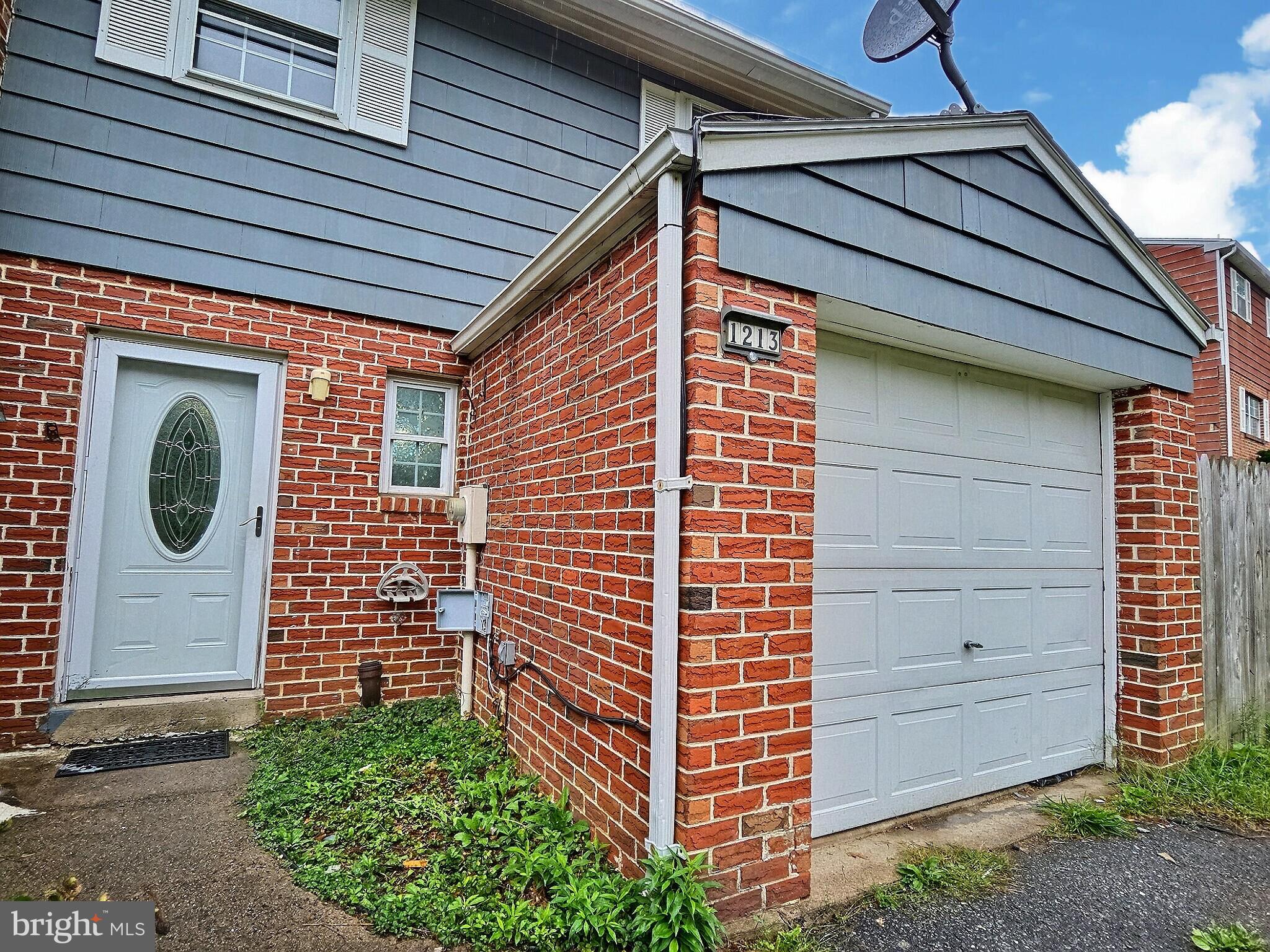 1213 Deer Run Reading, PA 19606 - Photo 5 of 42 a front view of a house with a garden