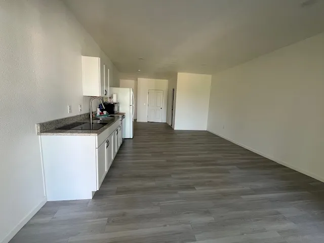 a view of a kitchen with a sink and dishwasher