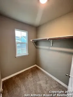 a view of a room with racks on the wall