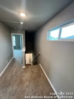 a view of an empty room and window