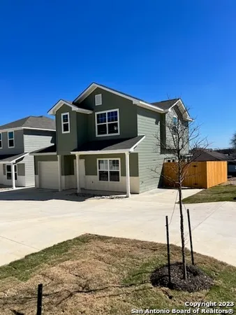 a front view of a house with parking