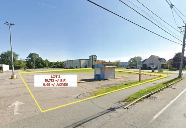 a view of a swimming pool with a yard