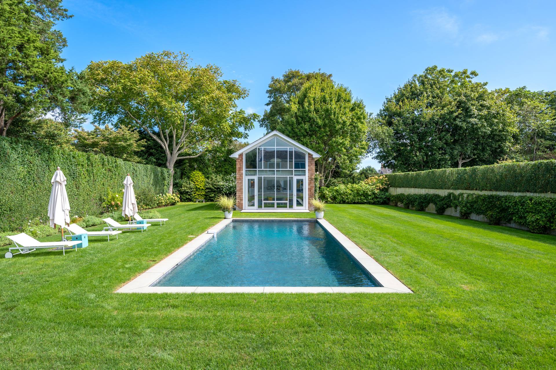Undisclosed Address Bridgehampton, NY 11932 - Photo 11 of 35 a view of yard with swimming pool and green space