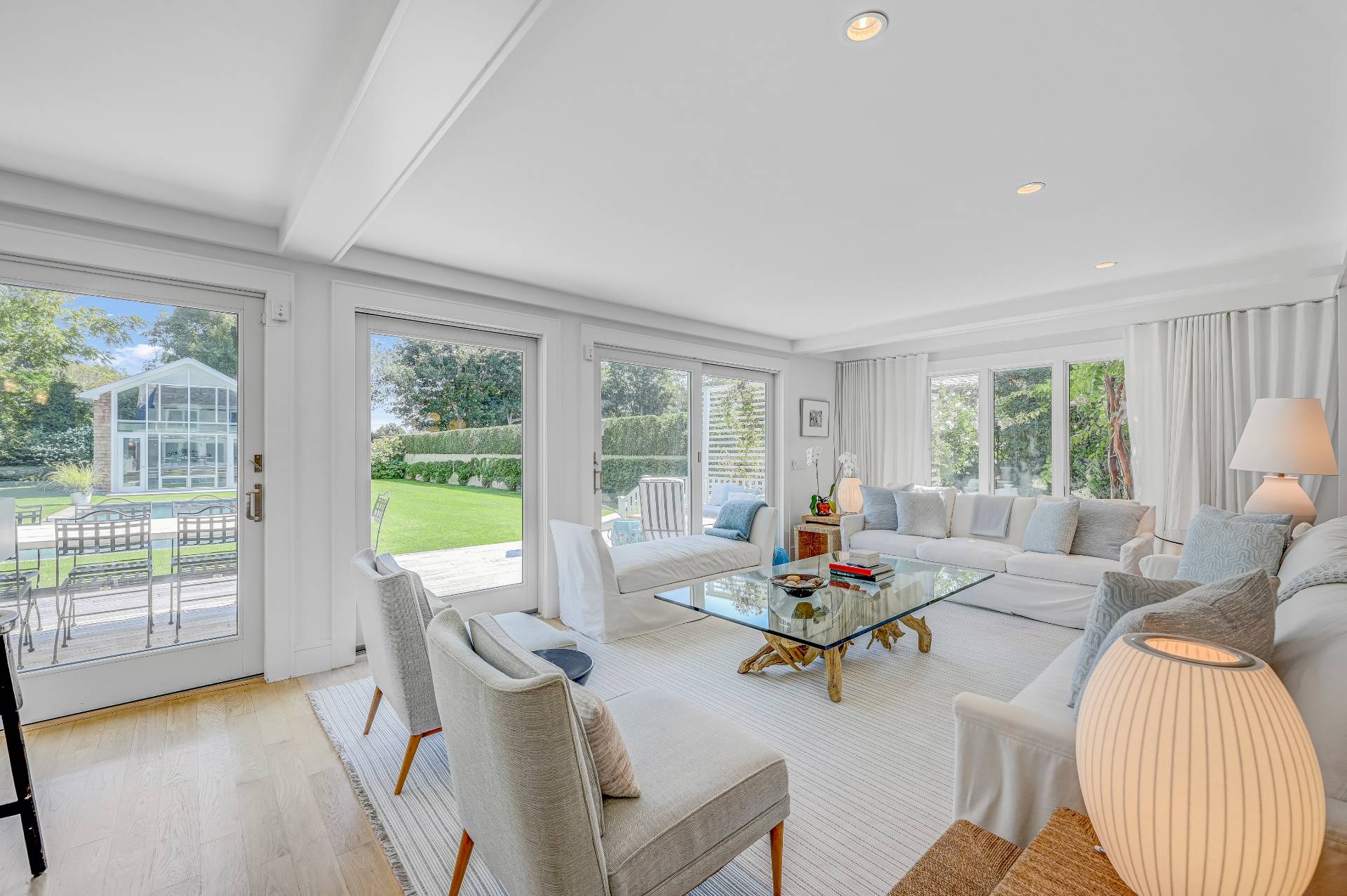 Undisclosed Address Bridgehampton, NY 11932 - Photo 15 of 35 a living room with furniture and floor to ceiling windows