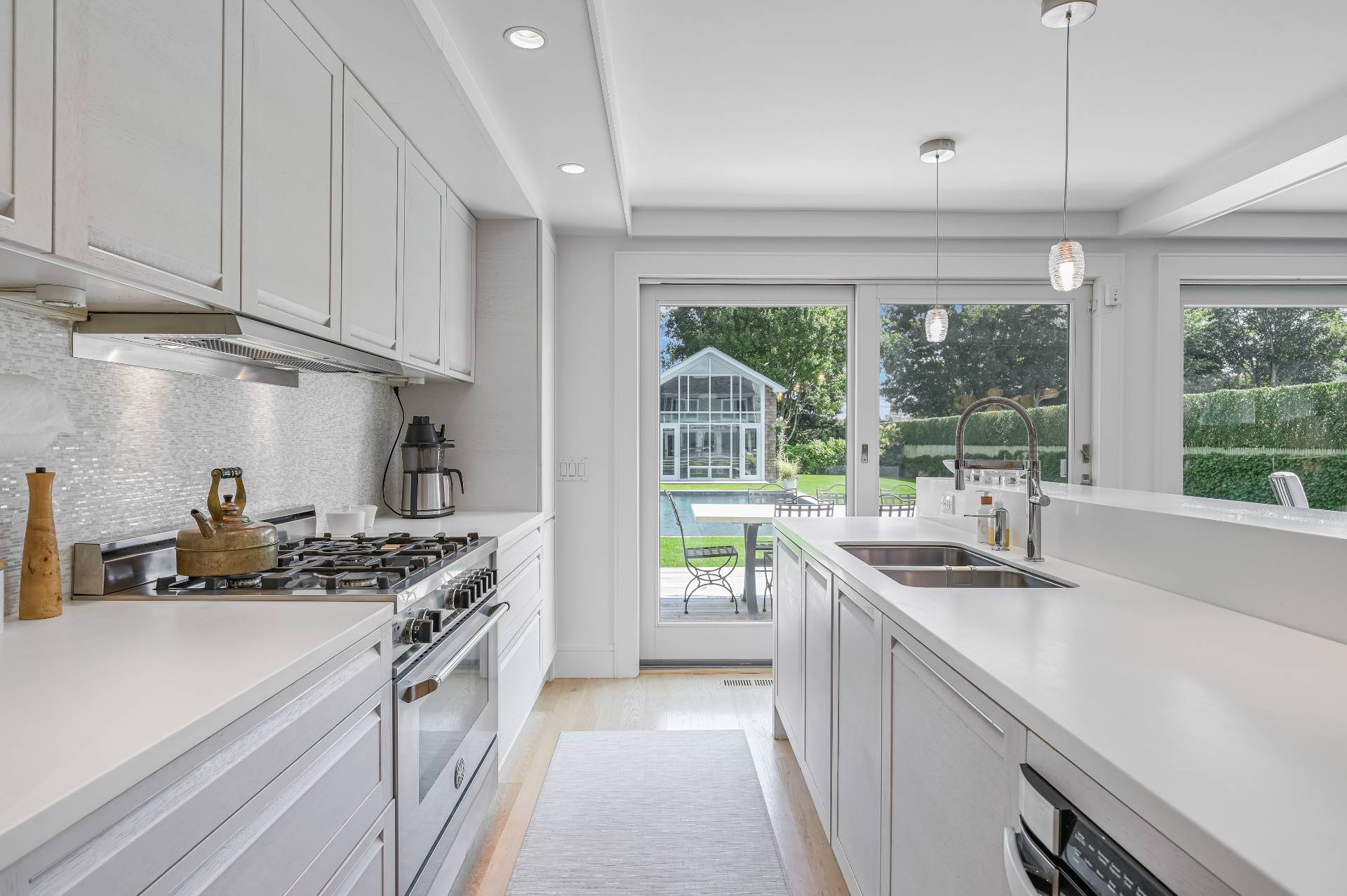 Undisclosed Address Bridgehampton, NY 11932 - Photo 19 of 35 a kitchen that has a sink and a stove