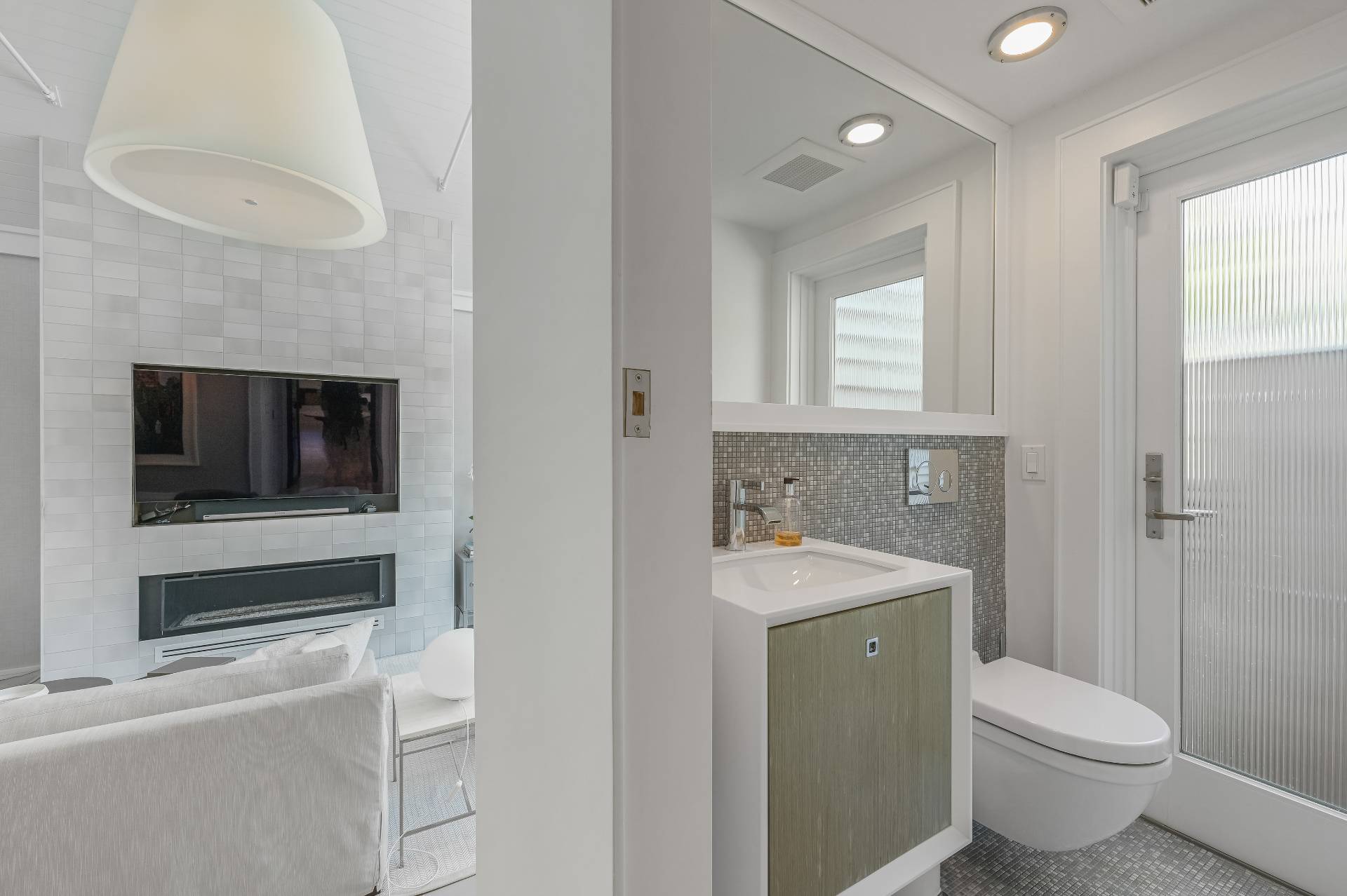 Undisclosed Address Bridgehampton, NY 11932 - Photo 21 of 35 a bathroom with a toilet a sink and mirror