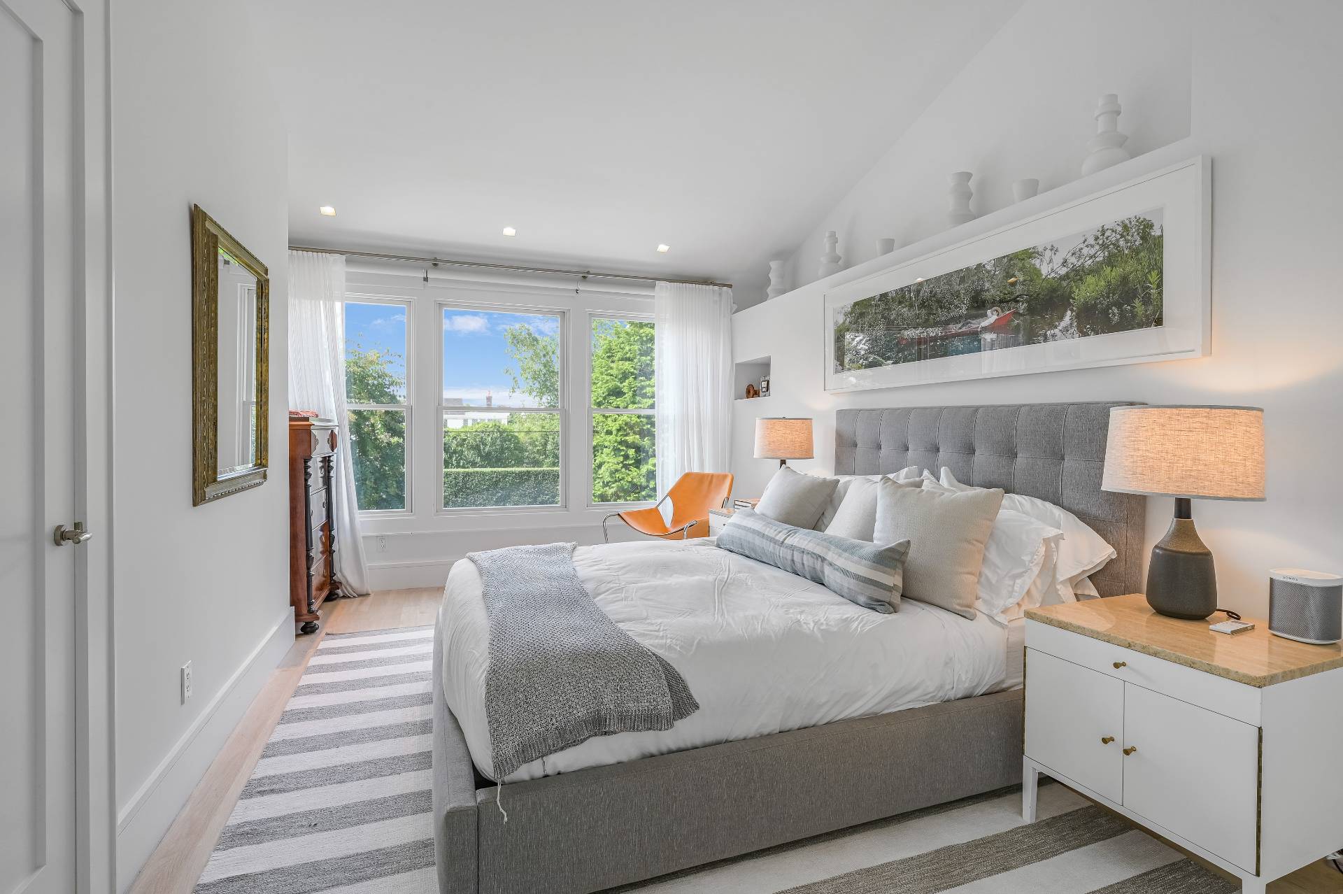 Undisclosed Address Bridgehampton, NY 11932 - Photo 27 of 35 a bedroom with a large bed and a window