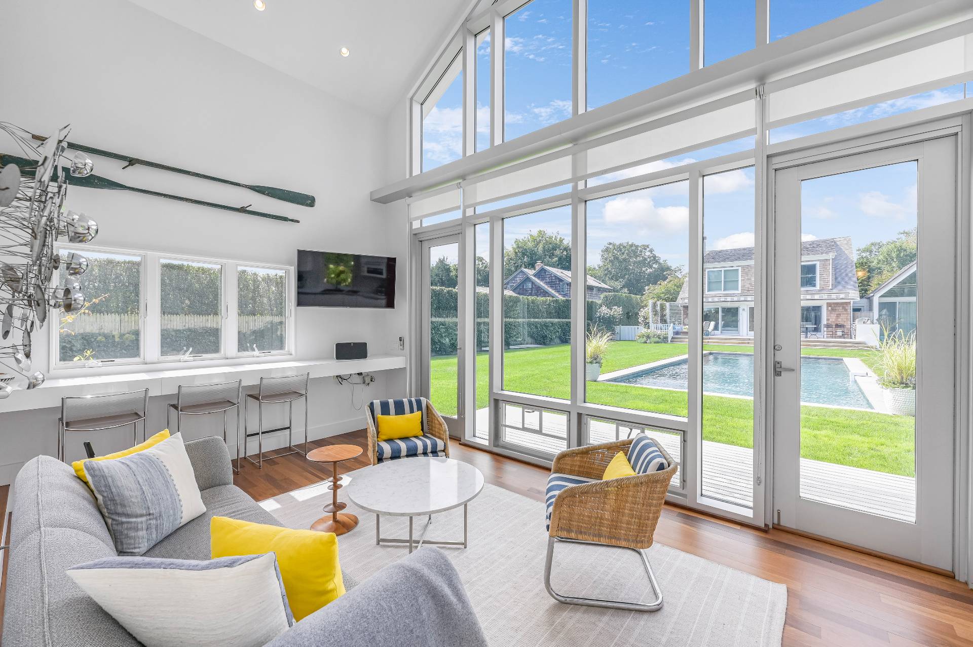 Undisclosed Address Bridgehampton, NY 11932 - Photo 30 of 35 a living room with furniture and floor to ceiling windows