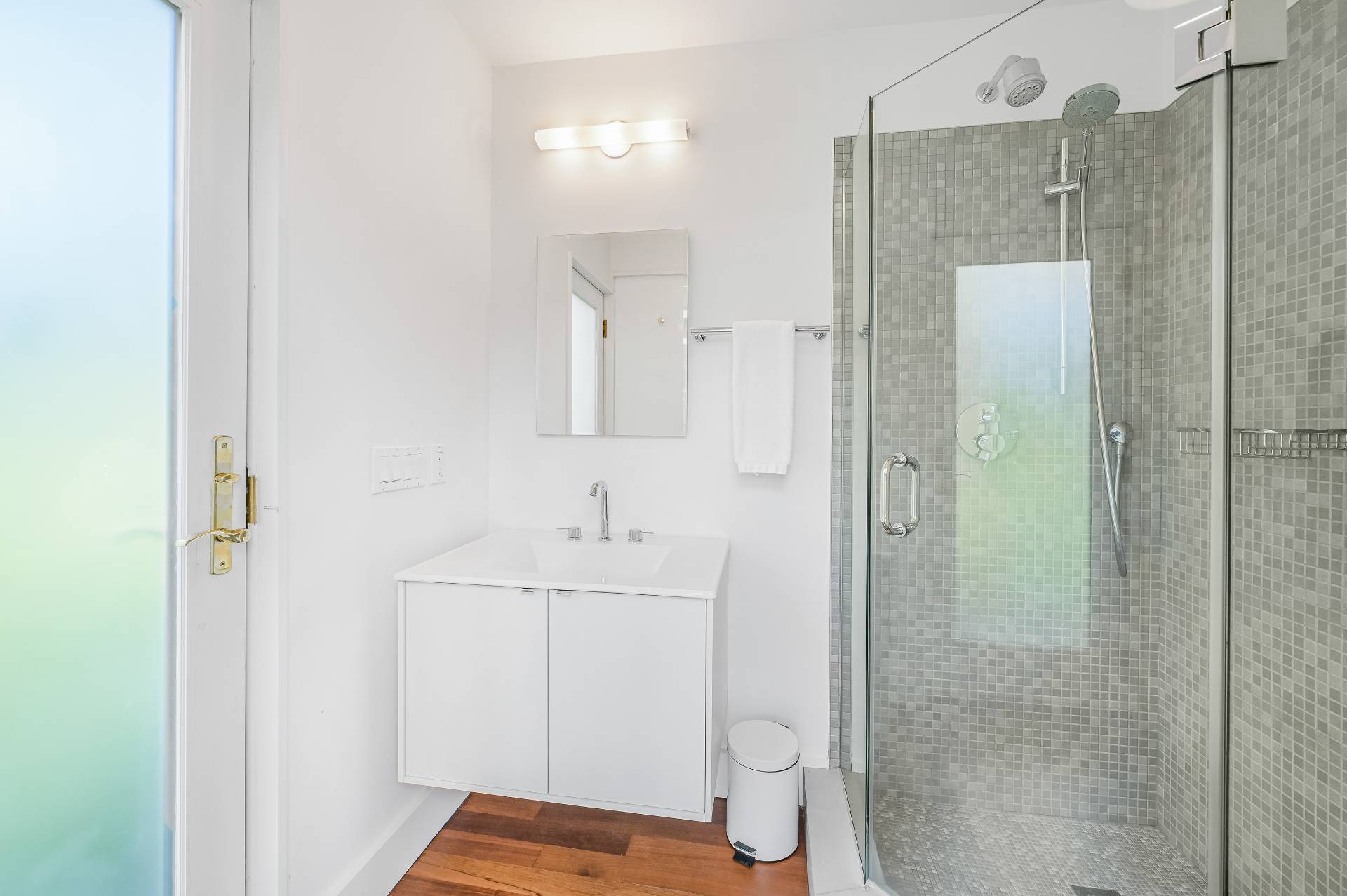 Undisclosed Address Bridgehampton, NY 11932 - Photo 33 of 35 a bathroom with a shower a sink and toilet