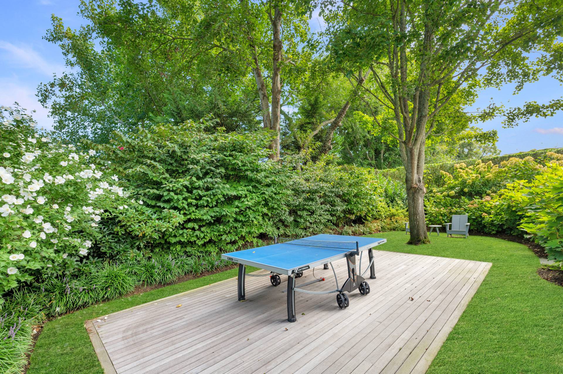 Undisclosed Address Bridgehampton, NY 11932 - Photo 34 of 35 a view of a chairs in backyard of the house