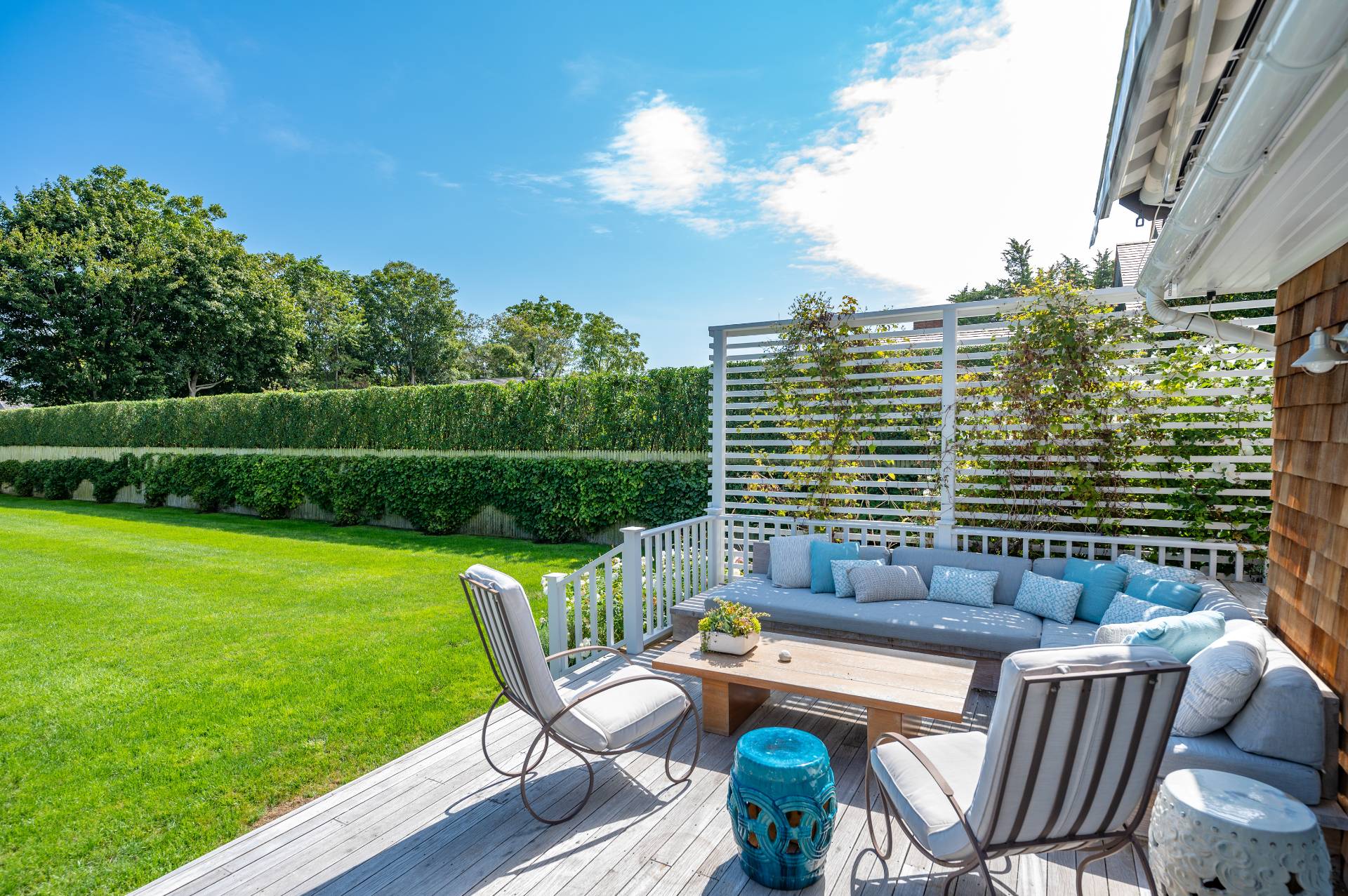 Undisclosed Address Bridgehampton, NY 11932 - Photo 8 of 35 a backyard of a house with outdoor seating