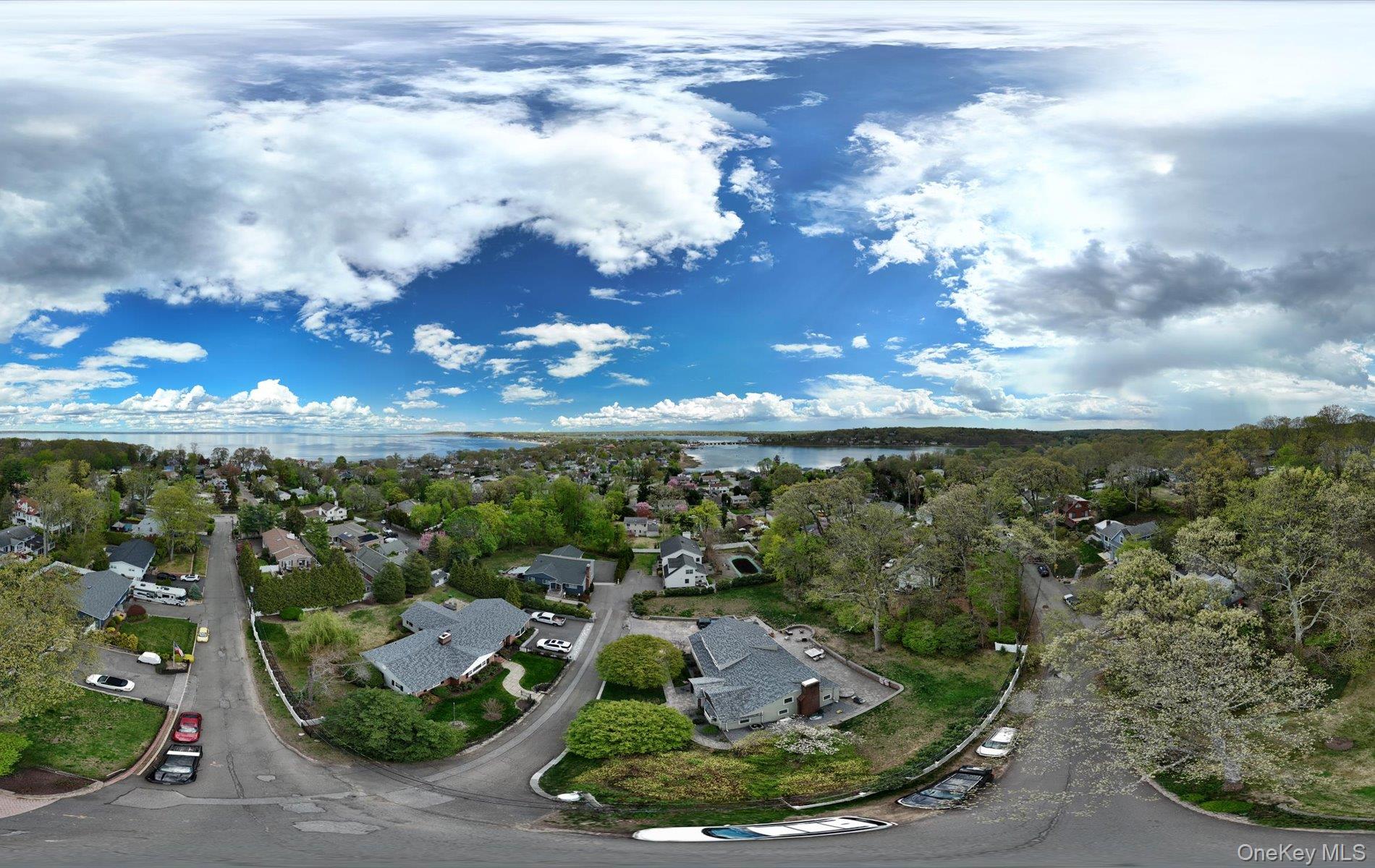 16 East Slope Road Bayville, NY 11709 - Photo 48 of 48 Expansive neighborhood offering water vistas, mature tree canopy, residential architecture, paved roads, and clear skies