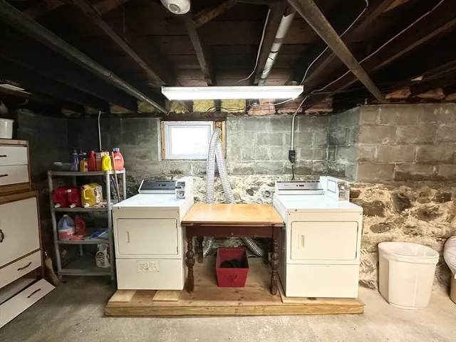 a view of house with outdoor space and parking