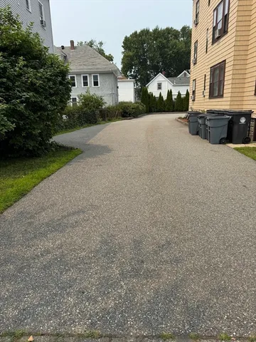 an aerial view of a residential apartment building with a yard