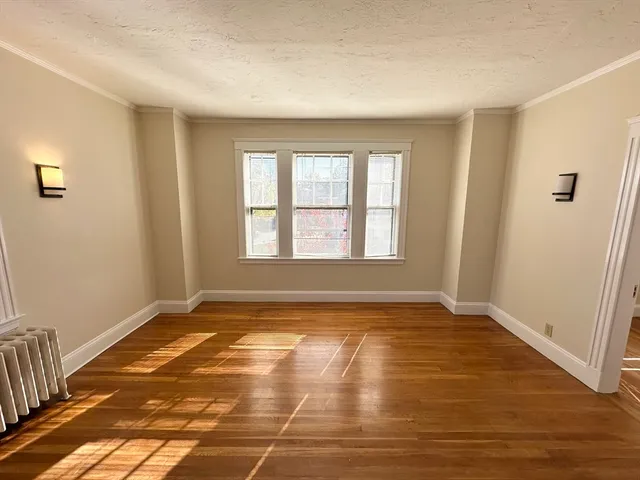 a view of an empty room and window