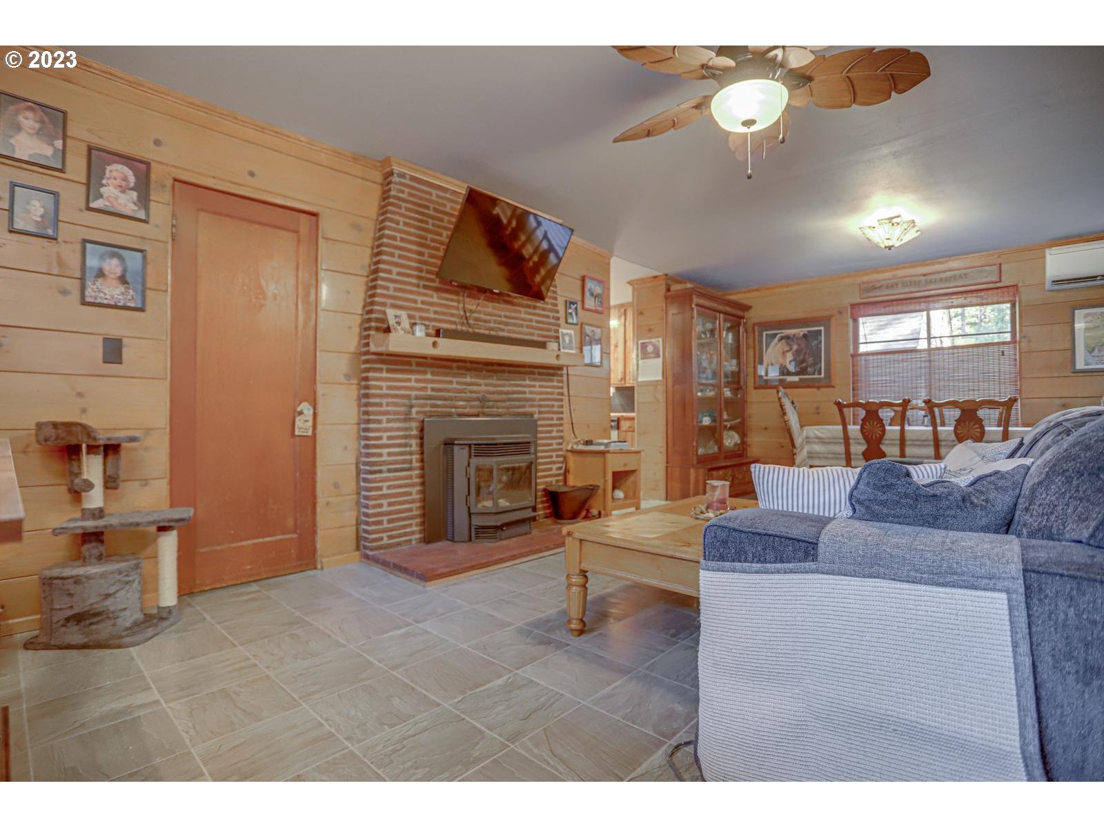 26877 East Chinook Lane Rhododendron, OR 97049 - Photo 14 of 48 a living room with furniture and a fireplace
