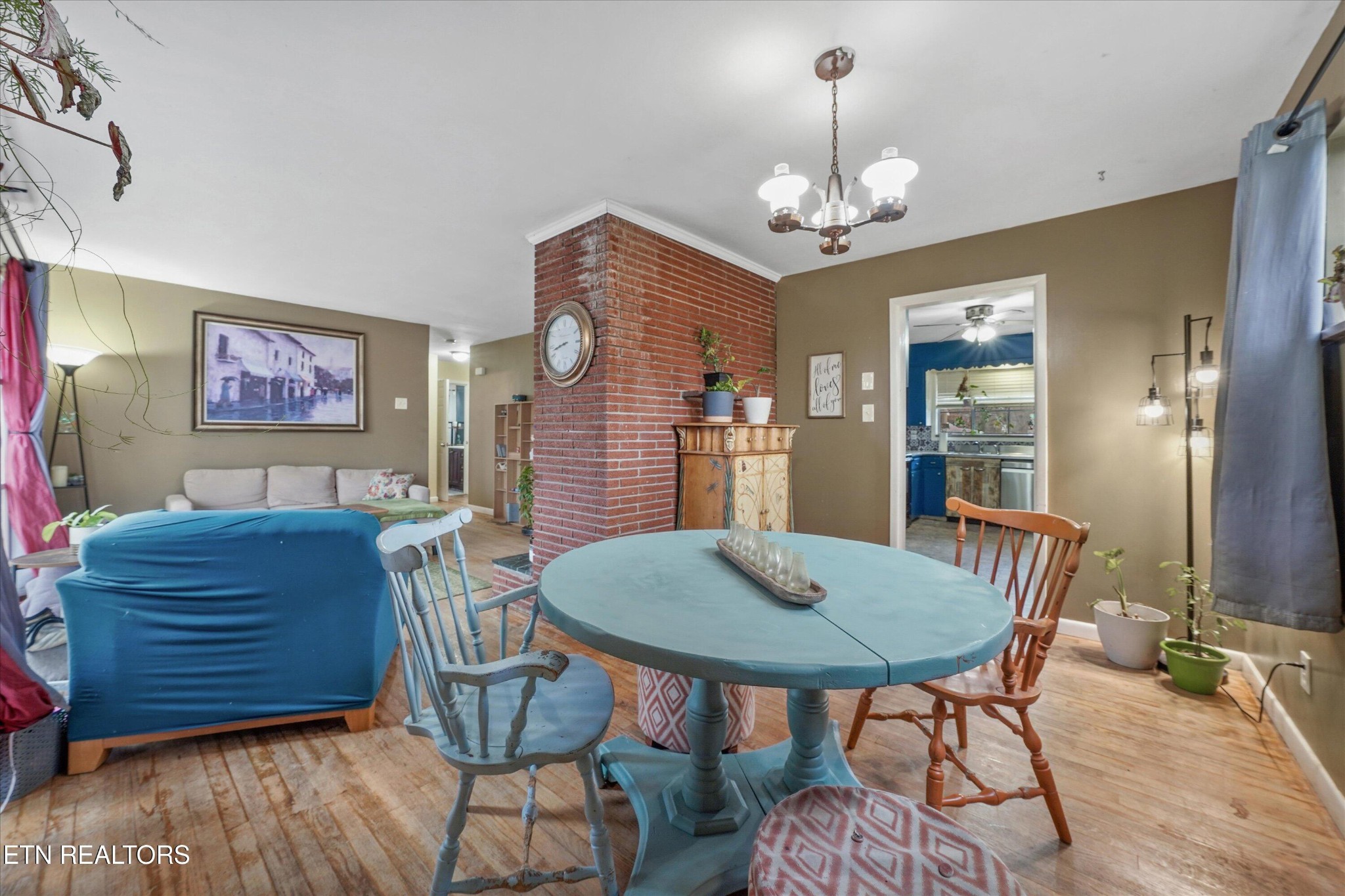 225 West Ford Valley Road Knoxville, TN 37920 - Photo 14 of 24 a view of a dining room with furniture wooden floor and chandelier