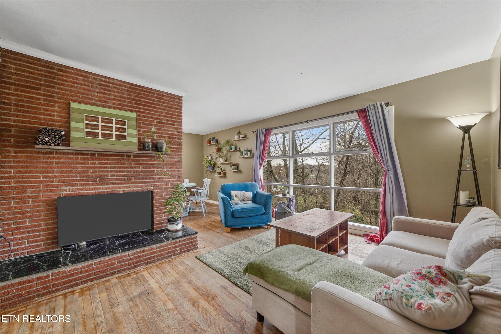 225 West Ford Valley Road Knoxville, TN 37920 - Photo 17 of 24 a living room with furniture tv and a fireplace