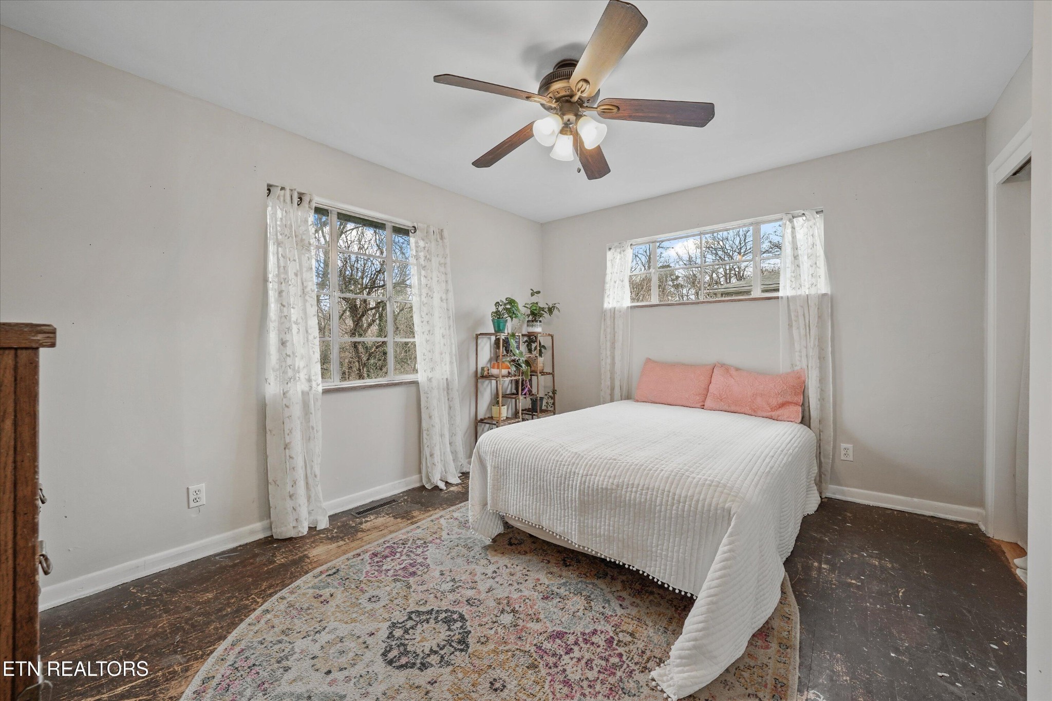 225 West Ford Valley Road Knoxville, TN 37920 - Photo 18 of 24 a bedroom with a large bed and a chandelier