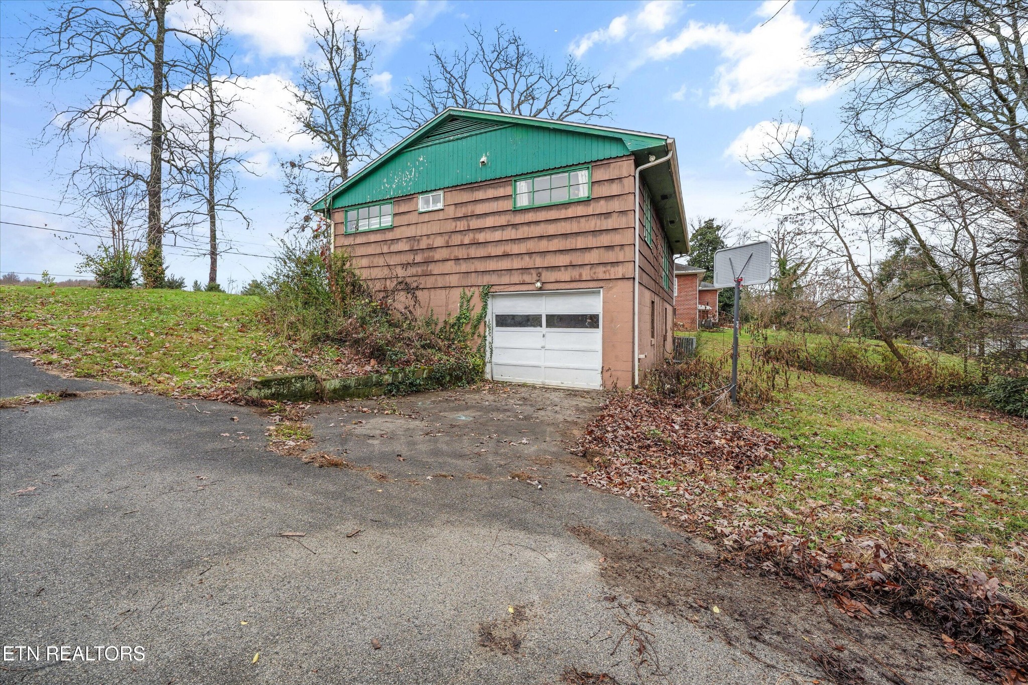225 West Ford Valley Road Knoxville, TN 37920 - Photo 24 of 24 a front view of a house with a yard and garage