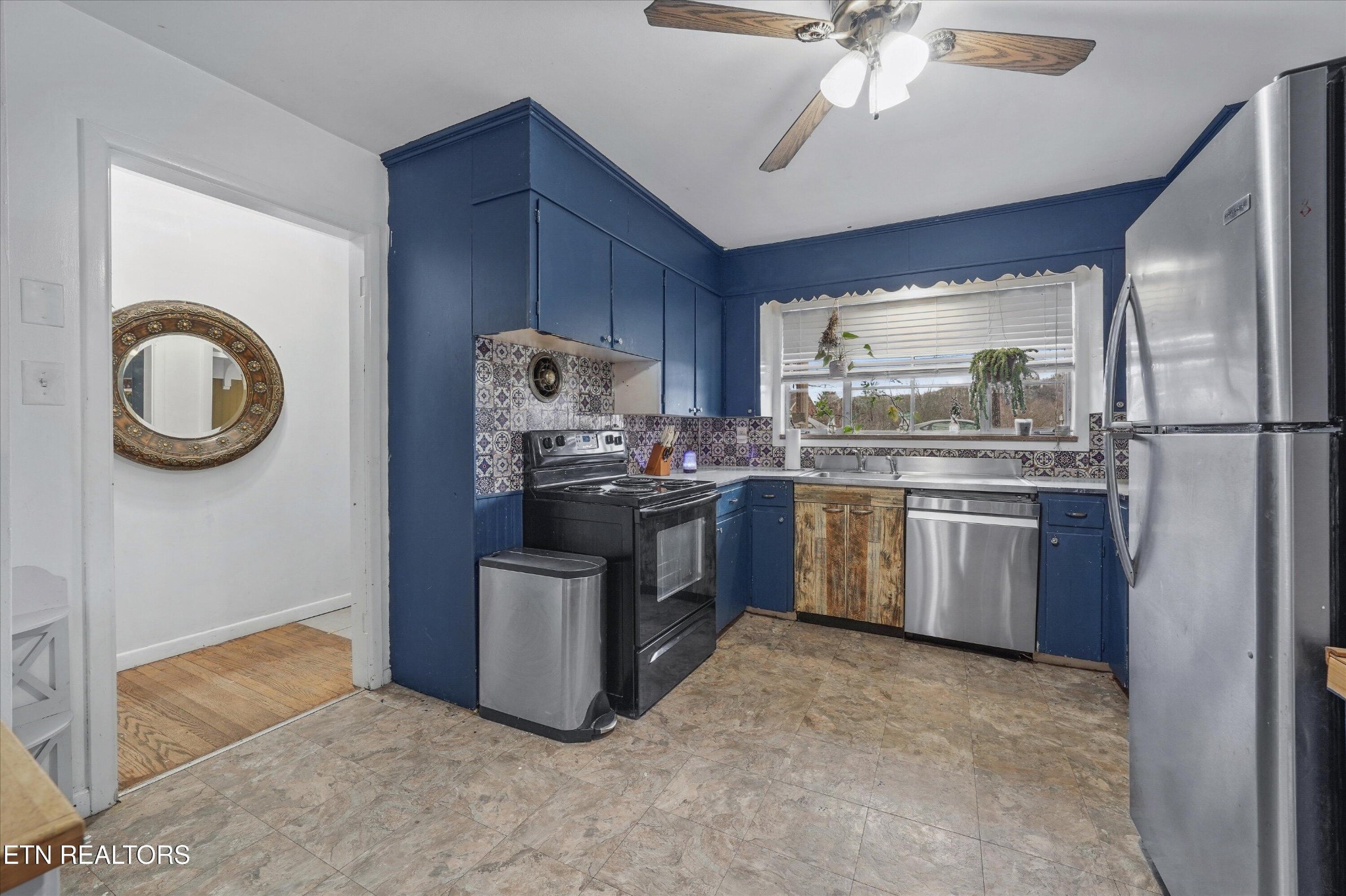 225 West Ford Valley Road Knoxville, TN 37920 - Photo 7 of 24 a kitchen with a refrigerator sink and cabinets